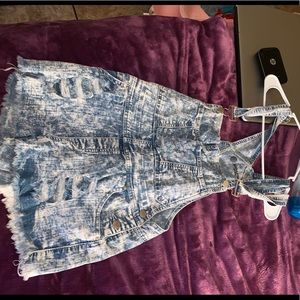 Light blue jean overalls with rips